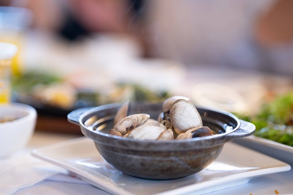 Seafood and rice dishes on a menu board.